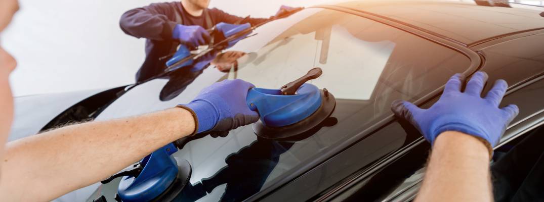 Unknown people replacing windshield 