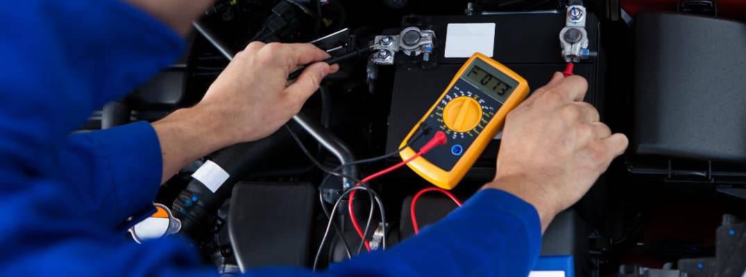 Tech checking battery.